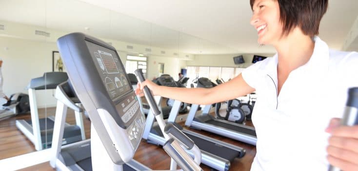 Woman using an elliptical in a fitness center