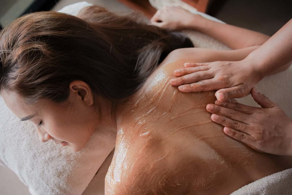 Woman receiving a massage at the Paresa Resort Spa