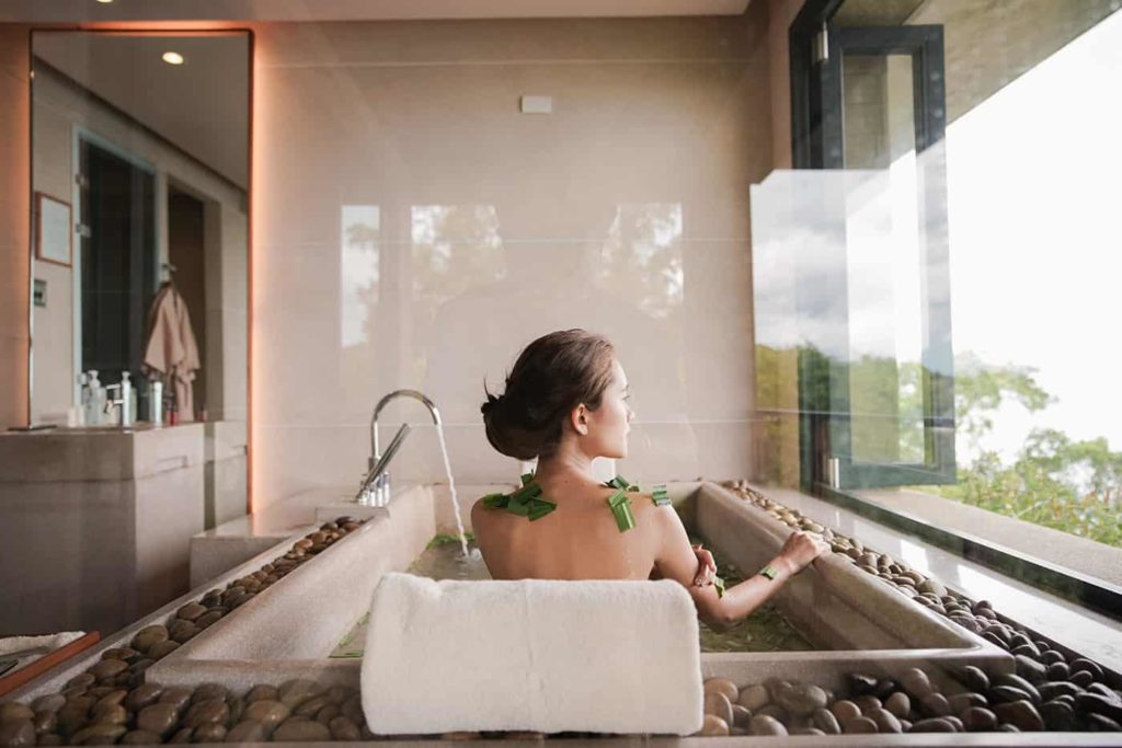 Woman bathing at the Paresa Resort Spa