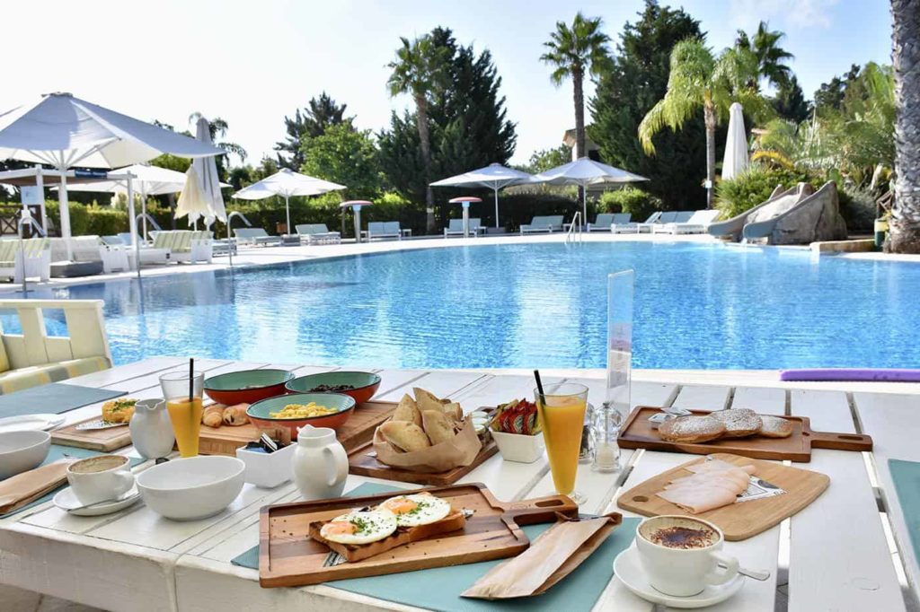 Breakfast foods set out by the pool at Martinhal Quinta