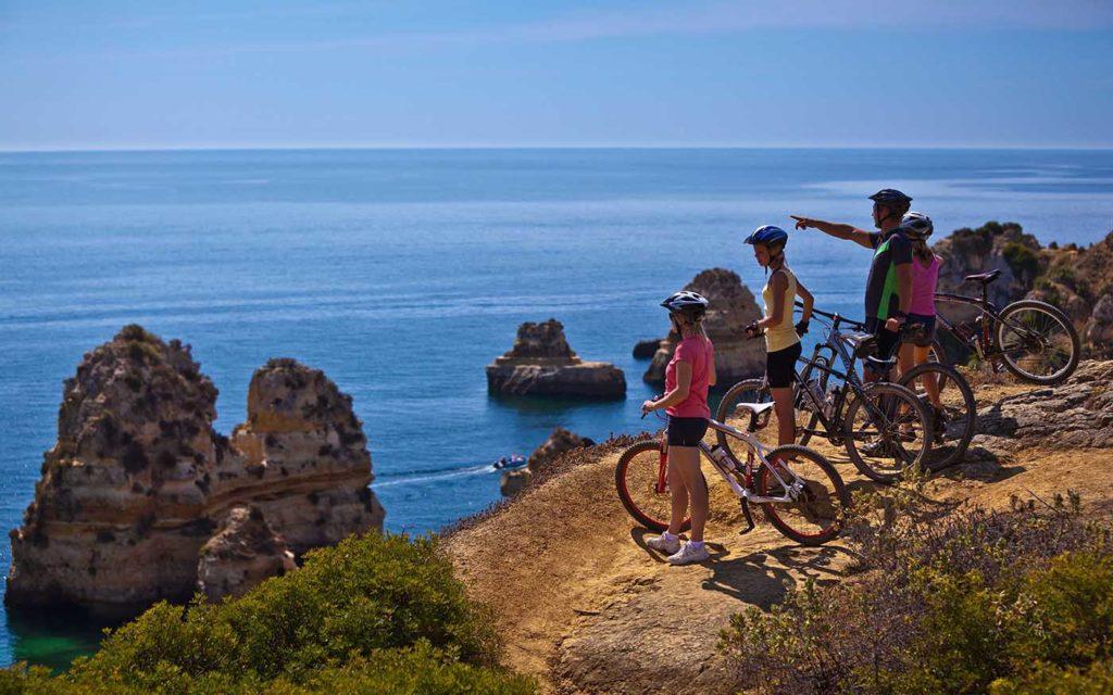 Group bike tour looking at ocean scenery