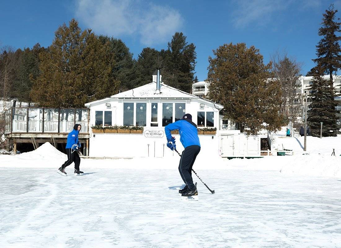 Men playing ice hockey at the Mirror Lake Inn