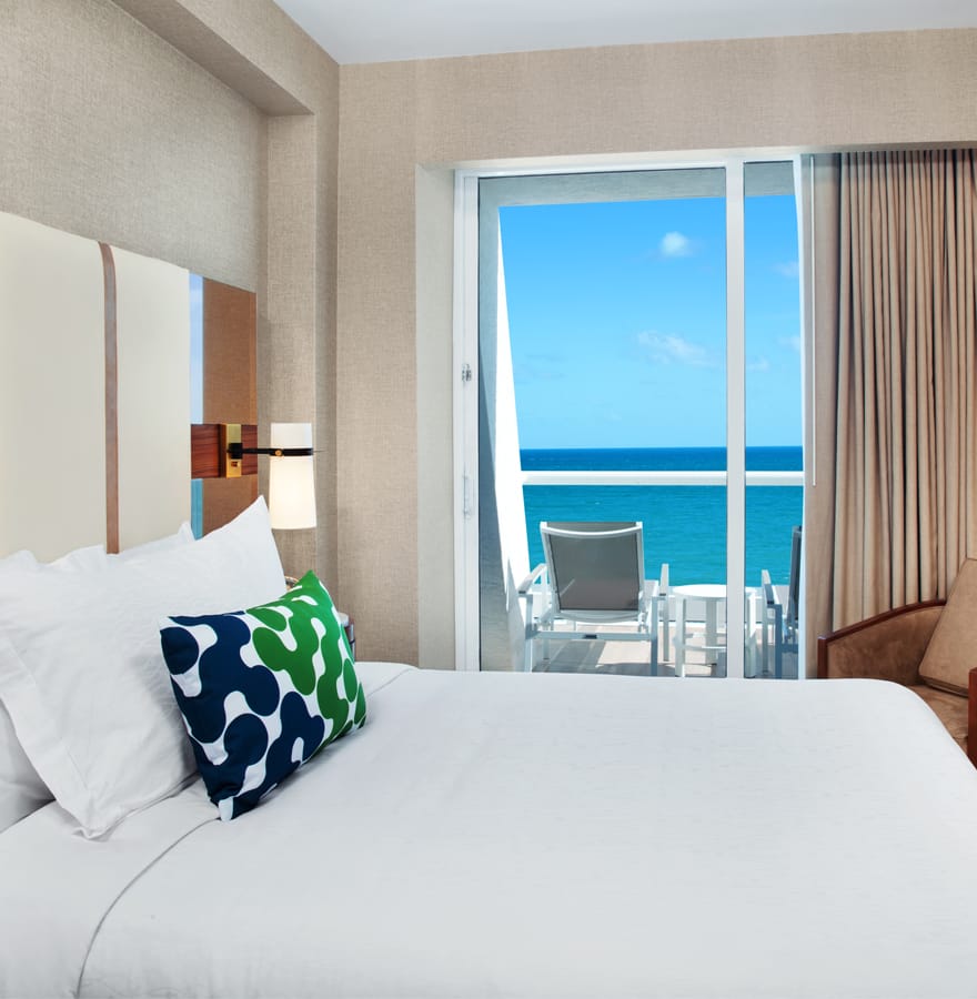 Oceanfront queen bed suite overlooking the water at Conrad Fort Lauderdale Beach