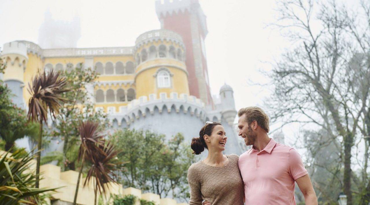 Couple in front of a historic castle