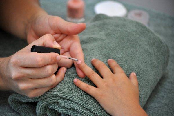 Close up of girl getting a manicure