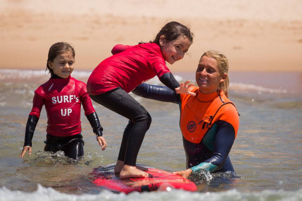 Children taking surf lessons