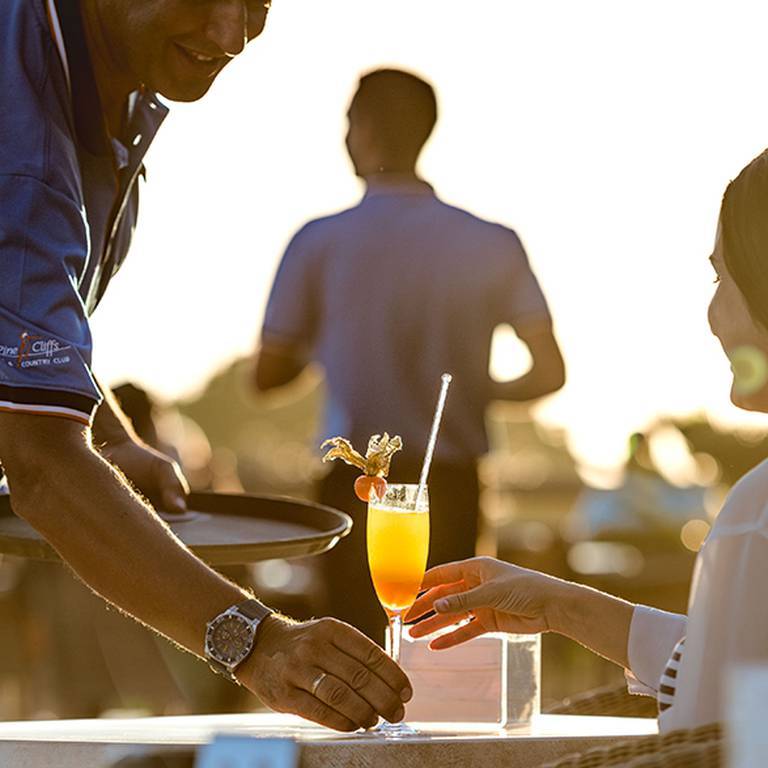 Woman being served champagne at the Mirador Champagne Bar