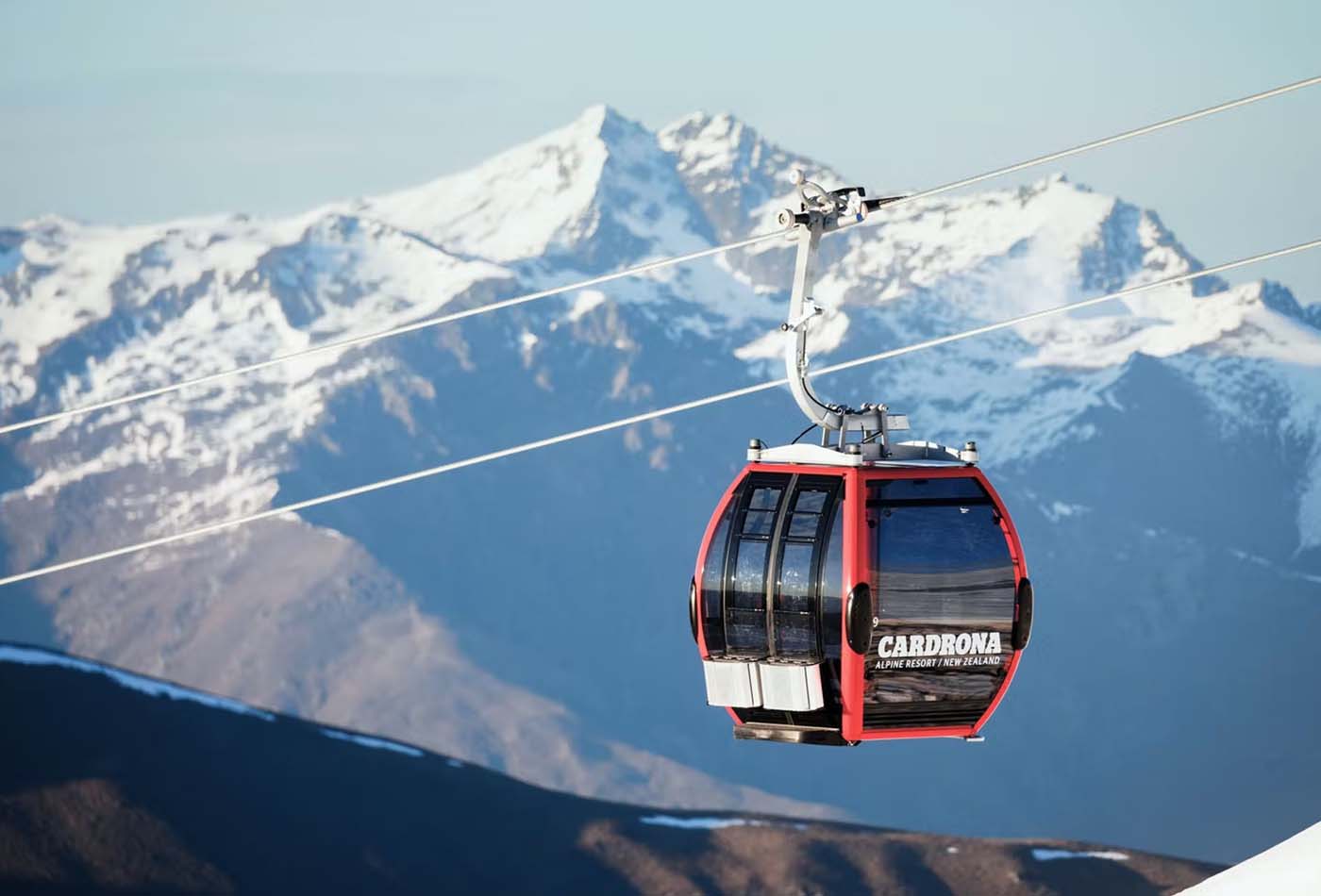 Close up of a gondola going up a mountain