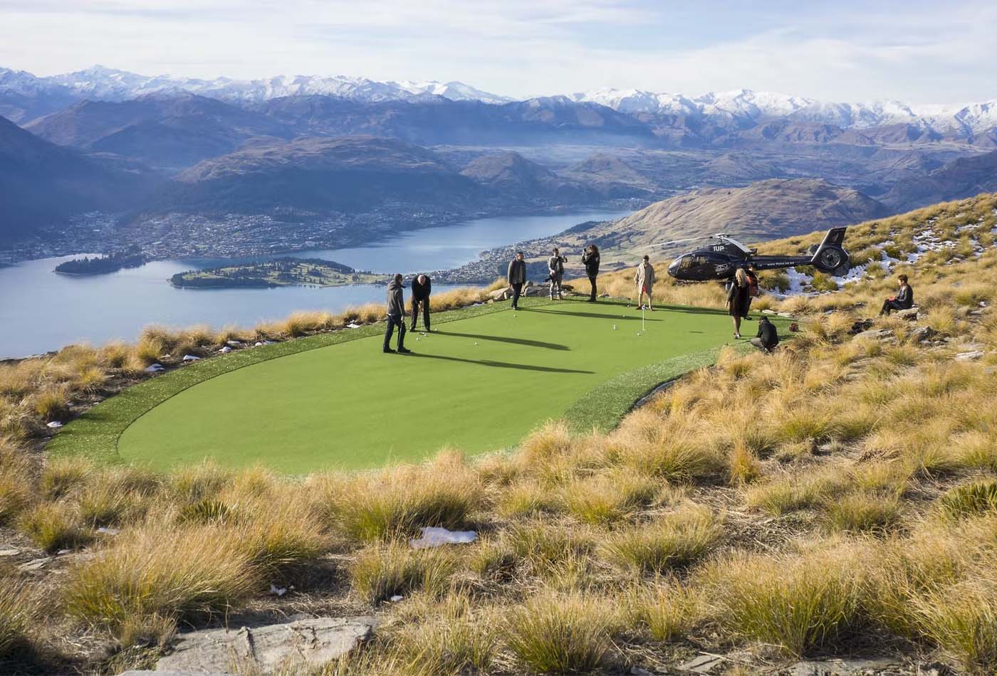 Group playing golf on a mountain