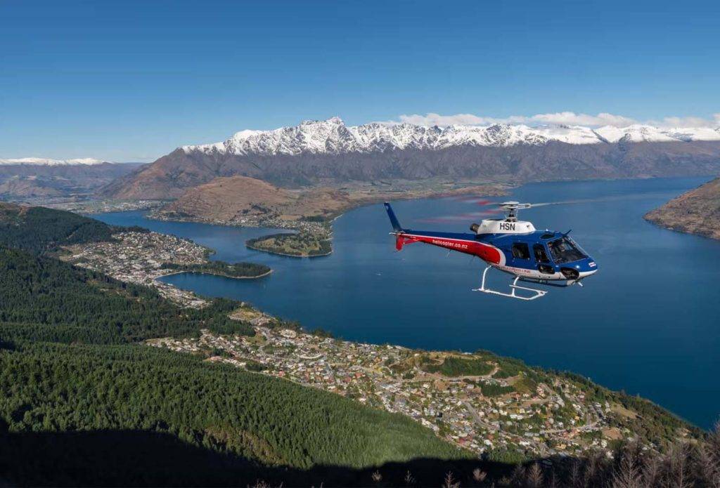 Helicopter flying over Queenstown, New Zealand