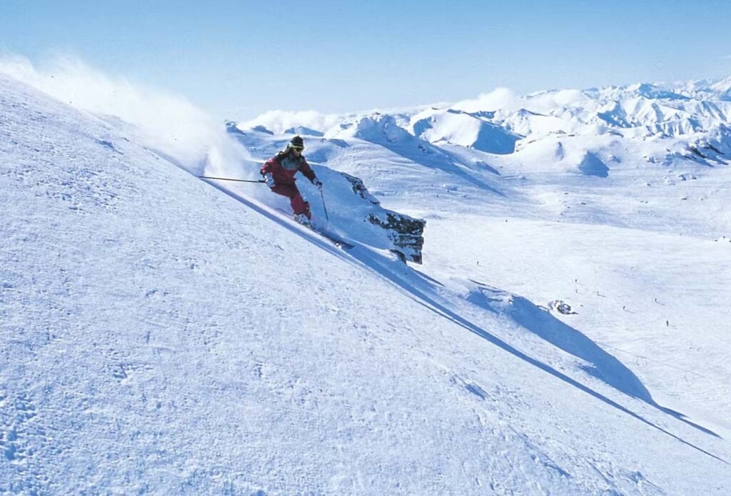 Skier going down a mountain