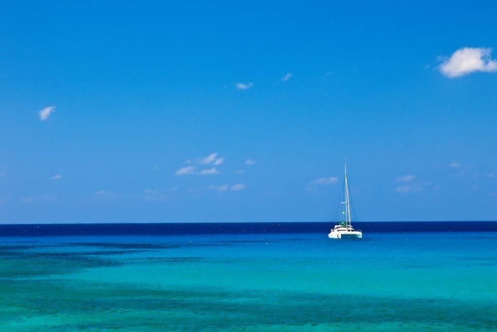 View of sailboat in the water at Rum Point Club.
