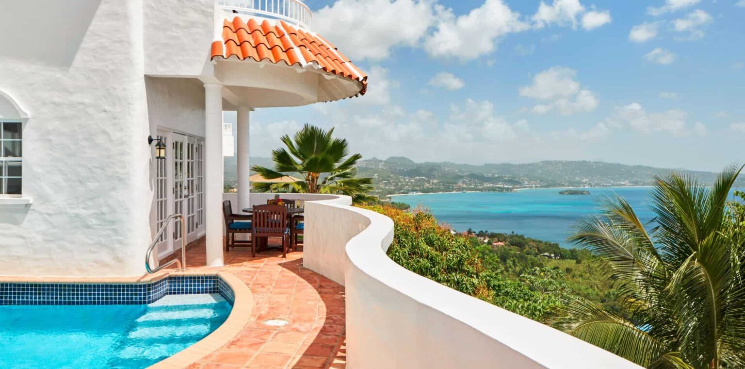 Estate villa beachfront balcony with pool at Windjammer Landing