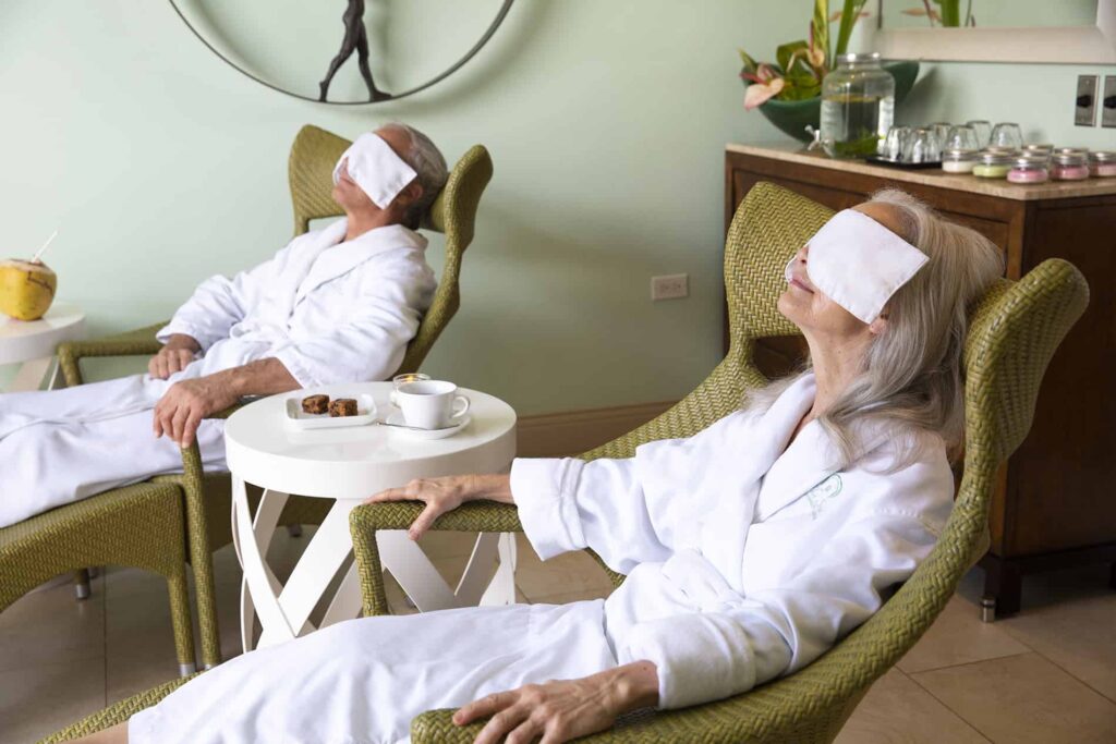 Couple with face masks in the Windjammer Landing spa lounge