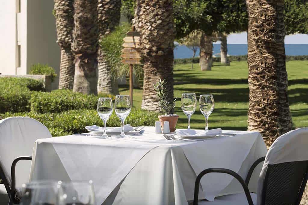 Tables and chairs at Piazza d'Italia | Agapi Beach Resort