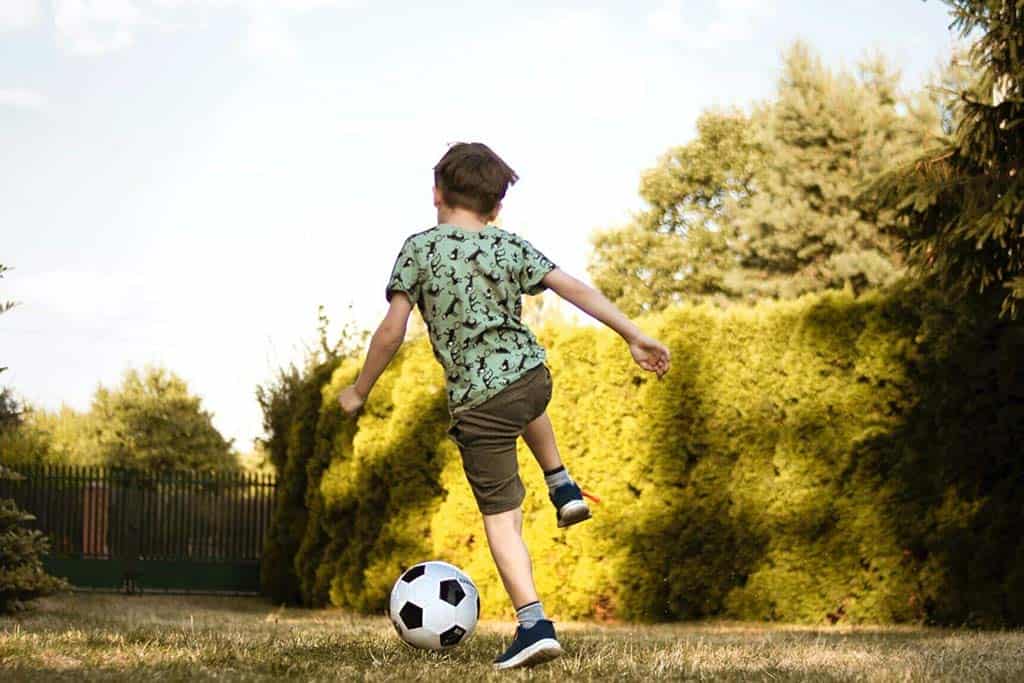 Little boy kicking a soccer ball | Agapi Beach Resort