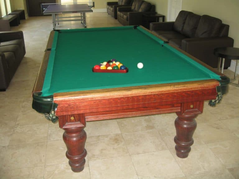 Ping pong and pool tables in The Atrium Resort game room.