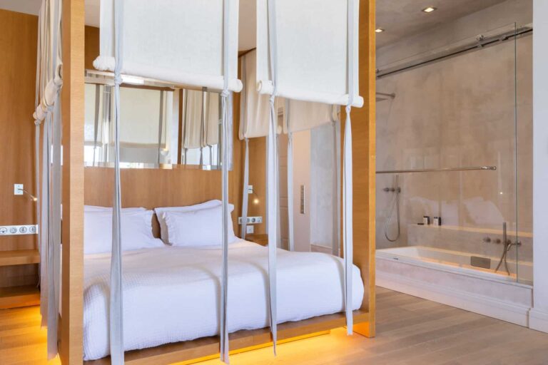 Dexamenes Beachfront Villa’s Suite king bed and walk-in bathtub