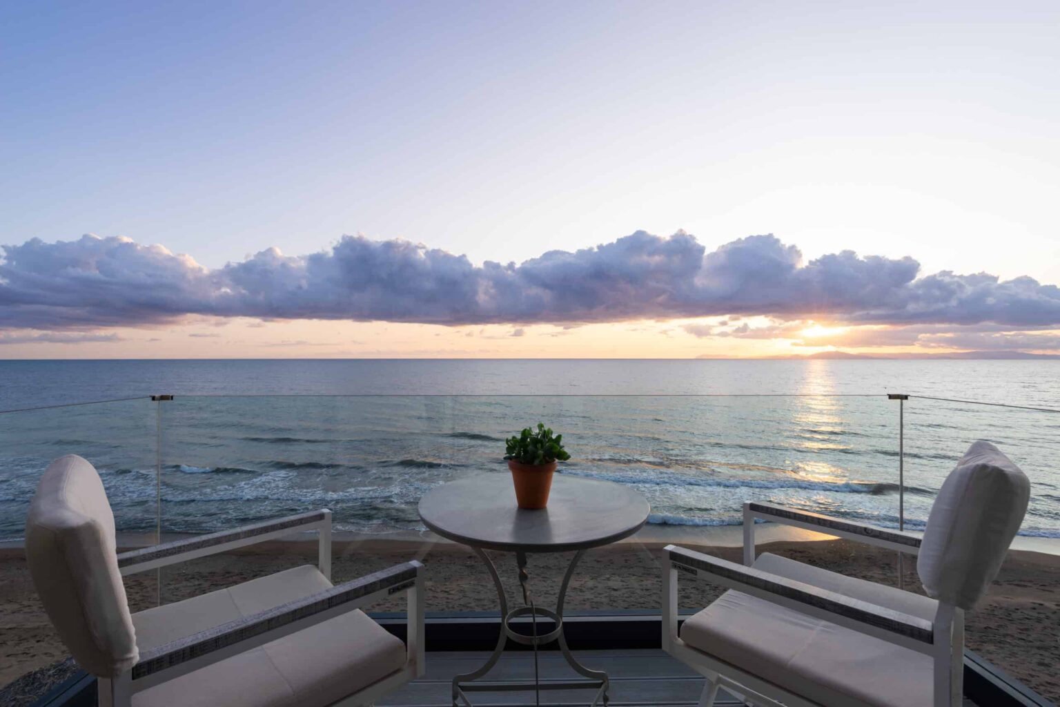 Dexamenes Beachfront Villa’s Suite terrace overlooking the water