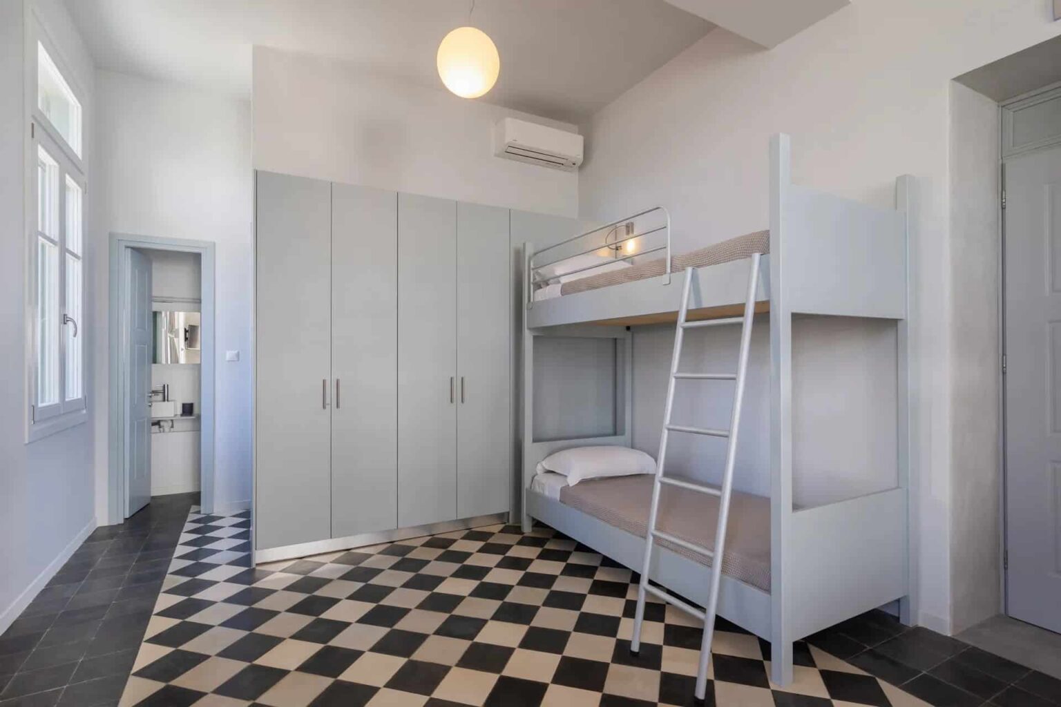 Dexamenes Beachfront Villa bedroom with double bunk beds