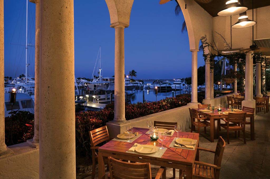 Evening outdoor dining overlooking marina