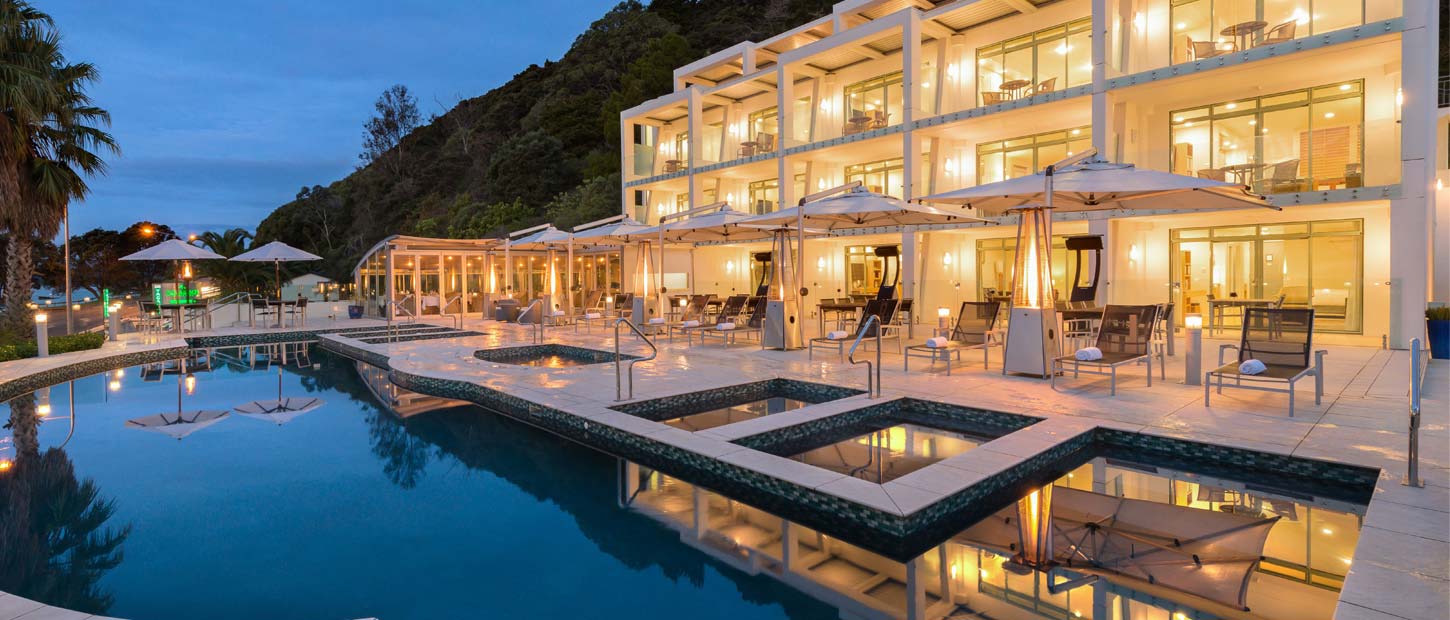Paihia Beach Resort pool and suites at dusk