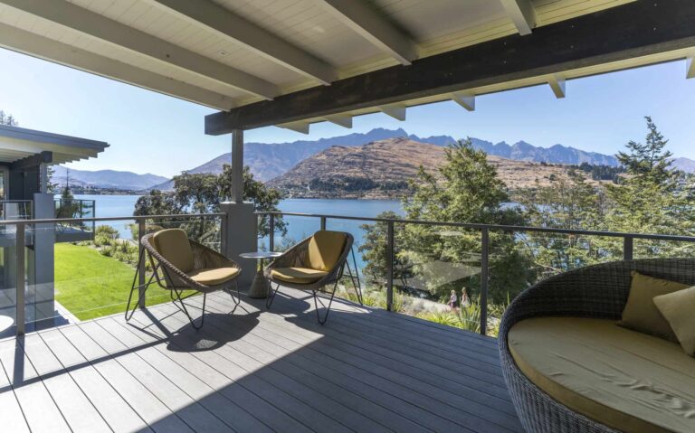 Covered balcony with cushioned seating: Lake View 3 Bedroom Villa