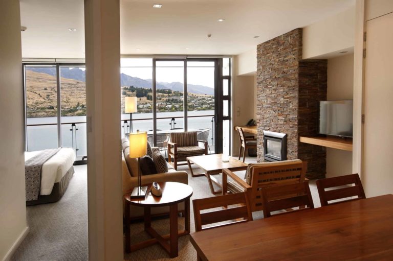 Living and dining room with balcony access: Lake View 2 Bedroom Apartment