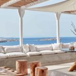 Boheme Mykonos suite covered balcony with plush seating and seaside views