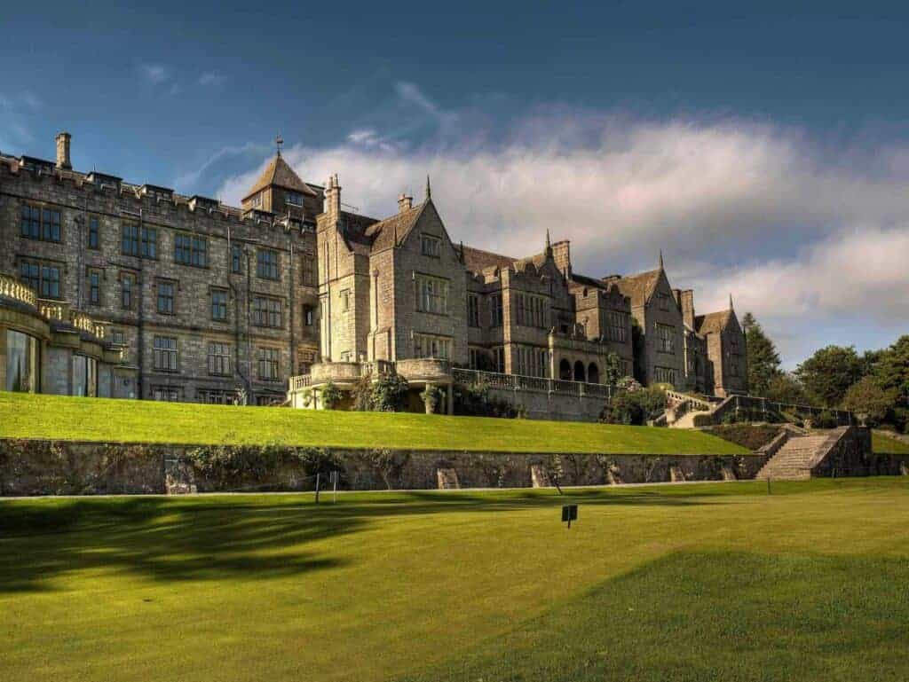 Bovey Castle exterior with expansive green and castle wall