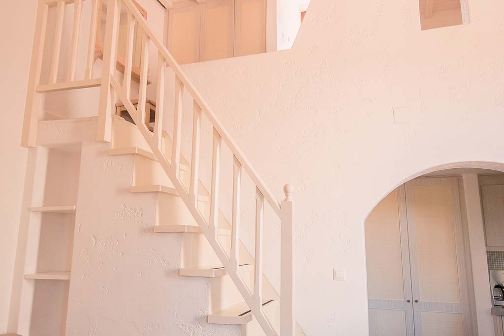 Cottage-Style Studio room stairs to loft bedroom