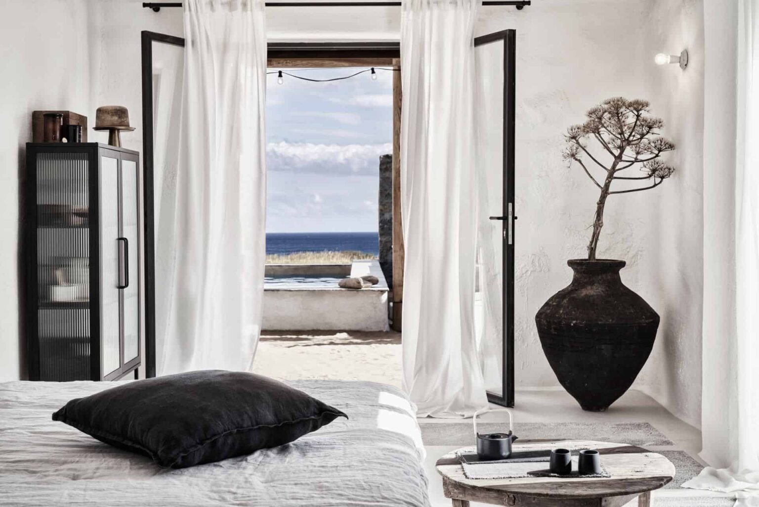 Nomad Mykonos bedroom suite with access to private pool and beautiful sea view