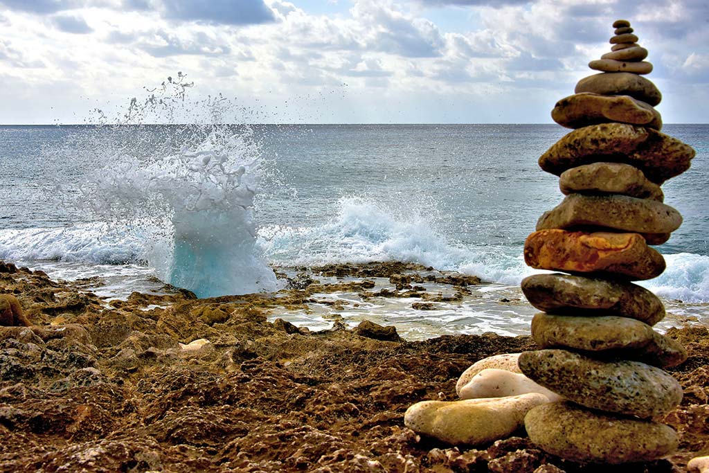 Rocks stacked in front of a blowhole on Grand Cayman