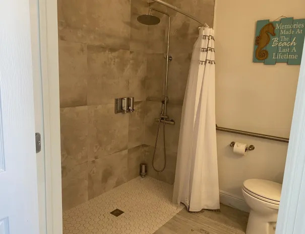 One Love guest bathroom with rain showerhead