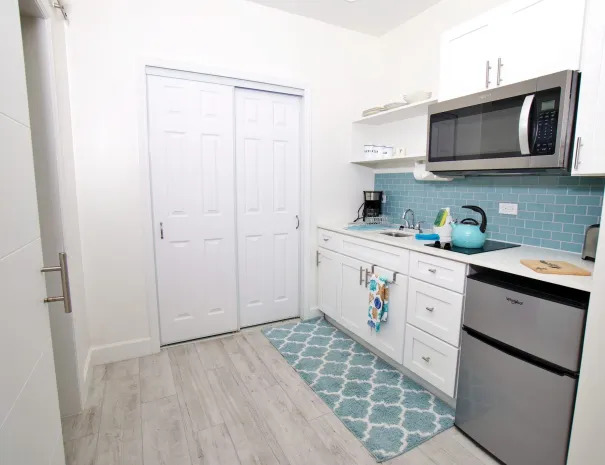 Starfish guest room kitchenette with mini fridge, microwave, tae kettle, and coffee maker