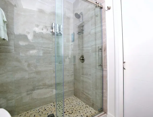 Starfish guest bathroom shower with sliding glass door