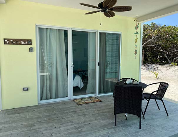 Turtle Nest guest room patio with dining table and chairs