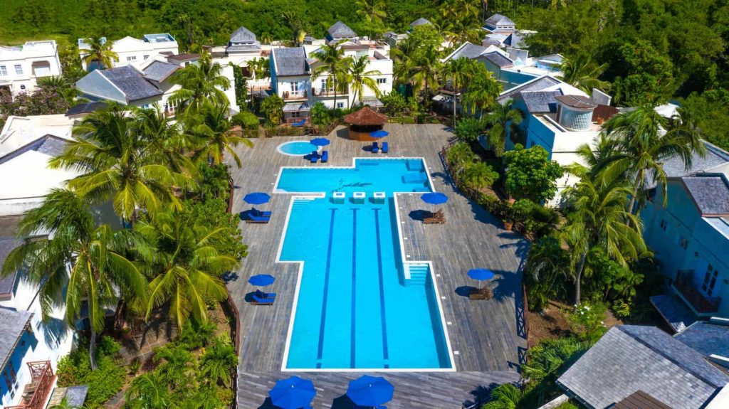 Cap Cove Resort pool and surrounding villas and suites