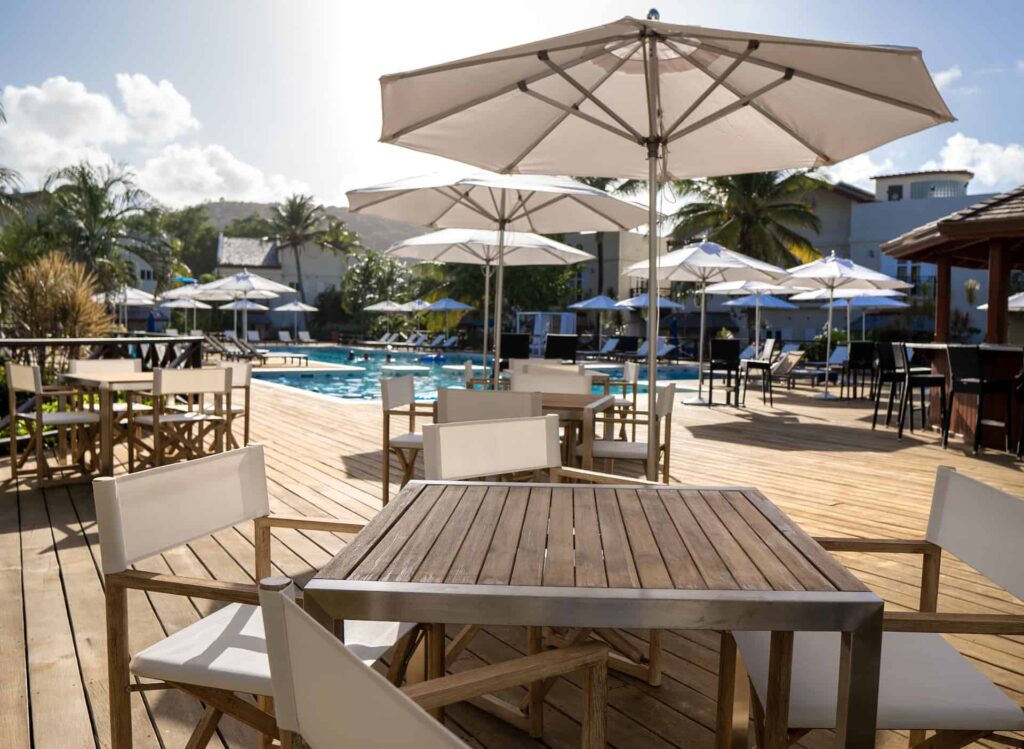Cap Cove Resort poolside bar and shaded tables