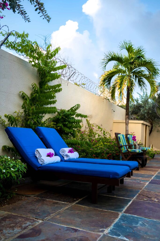 Cap Cove Resort private backyard sun loungers