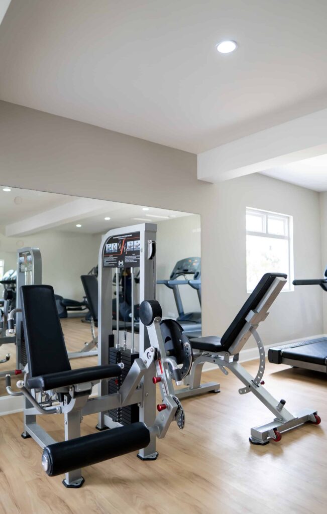 Cap Cove Resort fitness center with weightlifting machines and treadmills