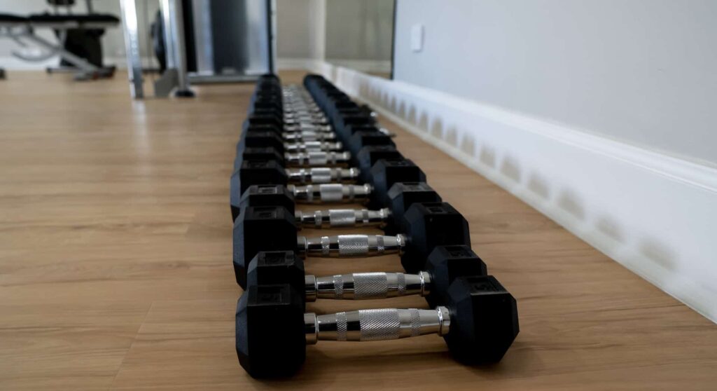 Row of lifting weights at the Cap Cove Resort fitness center