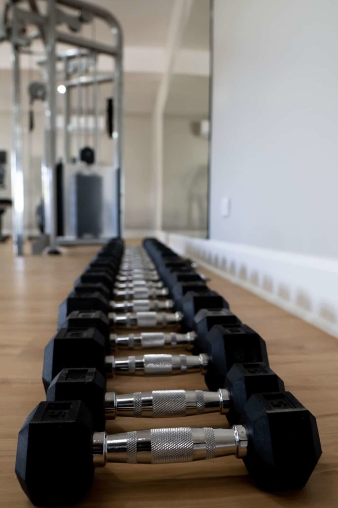 Row of weights in the Cap Cove Resort fitness center