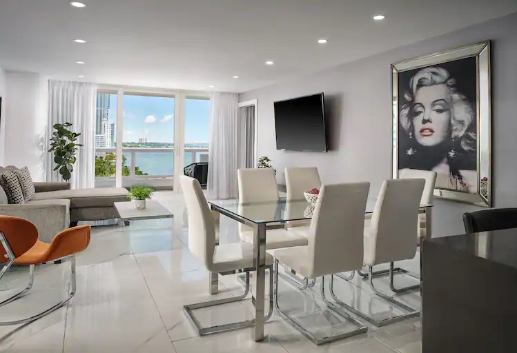 Living and dining area with bay view at Grand Hotel Biscayne Bay