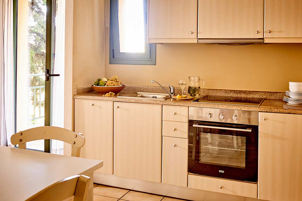 One Bedroom Suite kitchenette and dining table at the Village Heights Resort