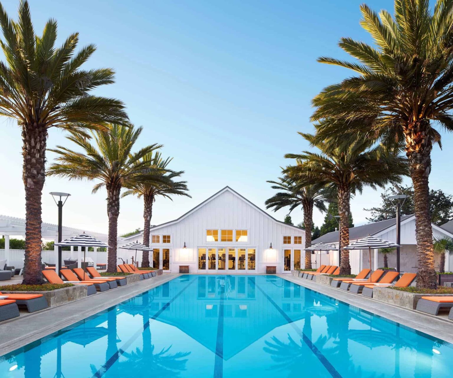 Carneros Resort & Spa pool surrounded by palm trees and sun loungers