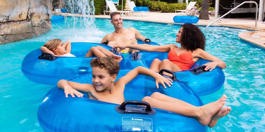 Family floating down the lazy river at the Reunion Resort Water Park