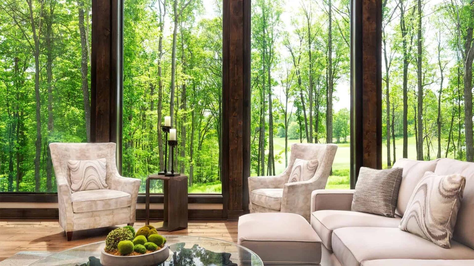 Dogwood Estate living room with woodland view at Nemacolin Woodlands Resort.