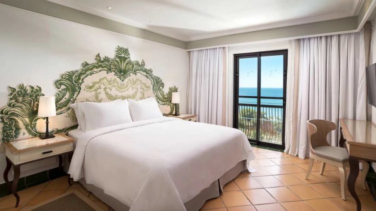 Pine Cliffs Resort - Duplex Suite bedroom with ocean view and a queen bed