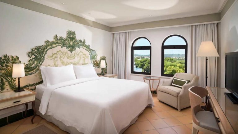 Pine Cliffs Resort - Duplex Suite bedroom with resort view and a queen bed